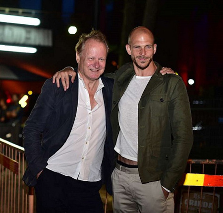 Gustaf and Stellan Ksarsgard pose outside.